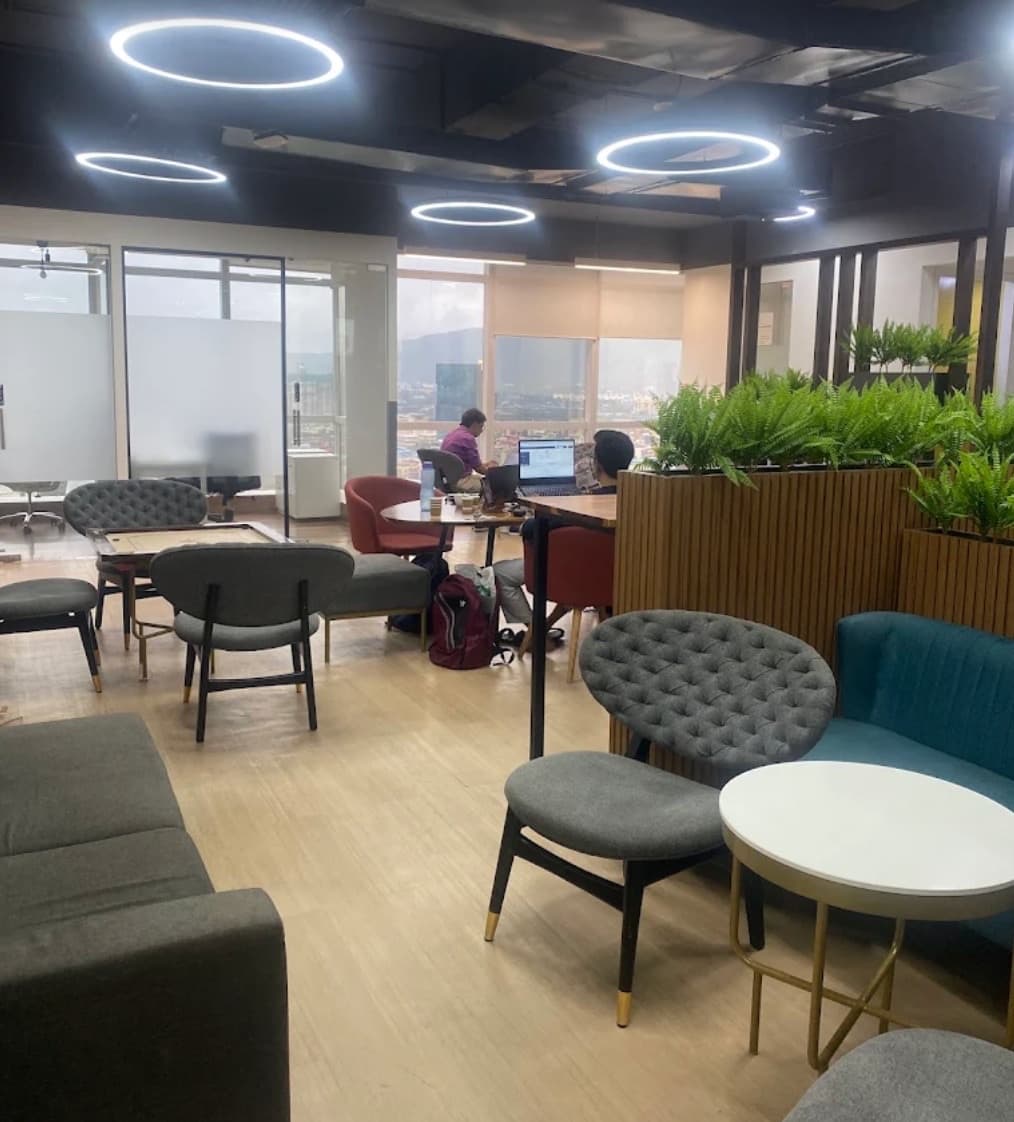The larger Indians Abroad office with its team and indoor plants